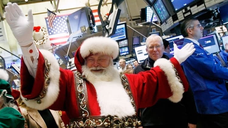 Annual NYSE tradition lives on: Traders sing on market floor to ring in holidays
