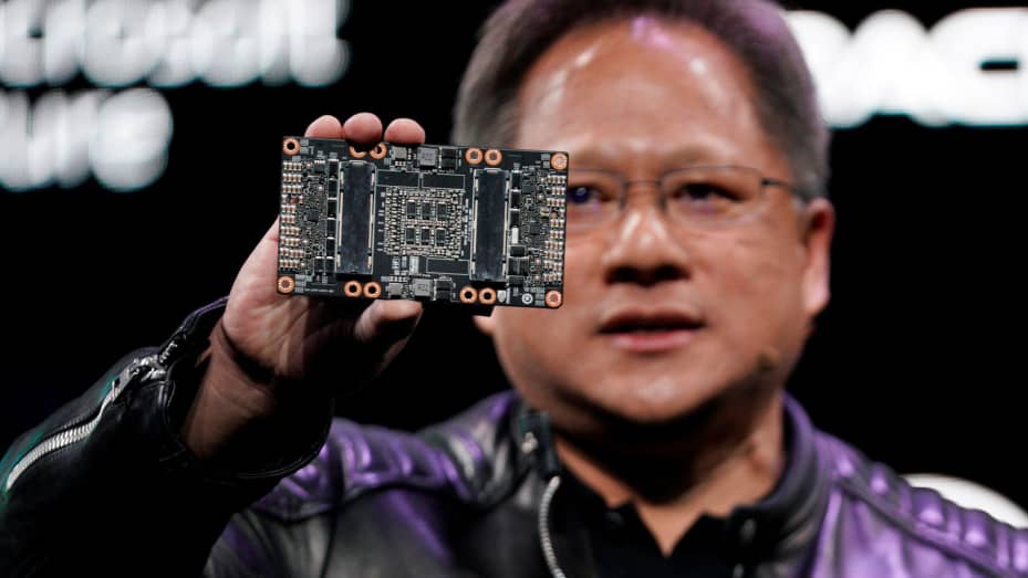 Jensen Huang, CEO of Nvidia, shows the Nvidia Volta GPU computing platform at his keynote address at CES in Las Vegas, Jan. 7, 2018.
