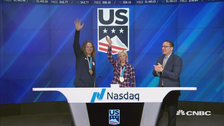 Gold medalists from Team USA ring the closing bell at Nasdaq MarketSite