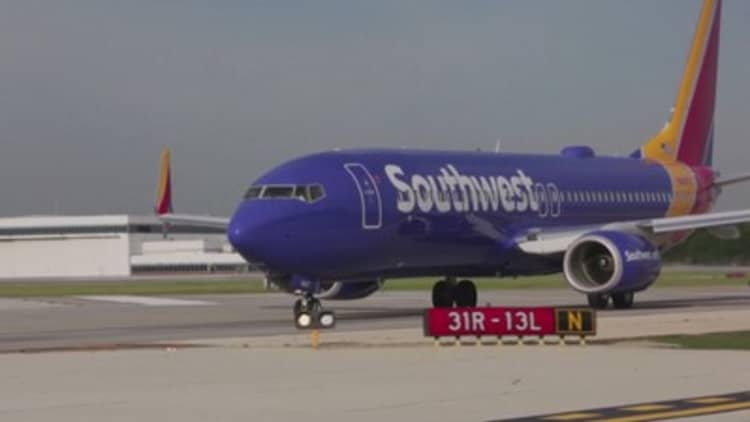 Southwest shares tumble after airline warns of persistently low fares