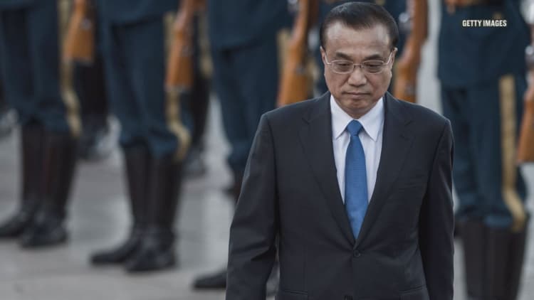 China's premier pledges open markets in an attempt to avoid trade war with US