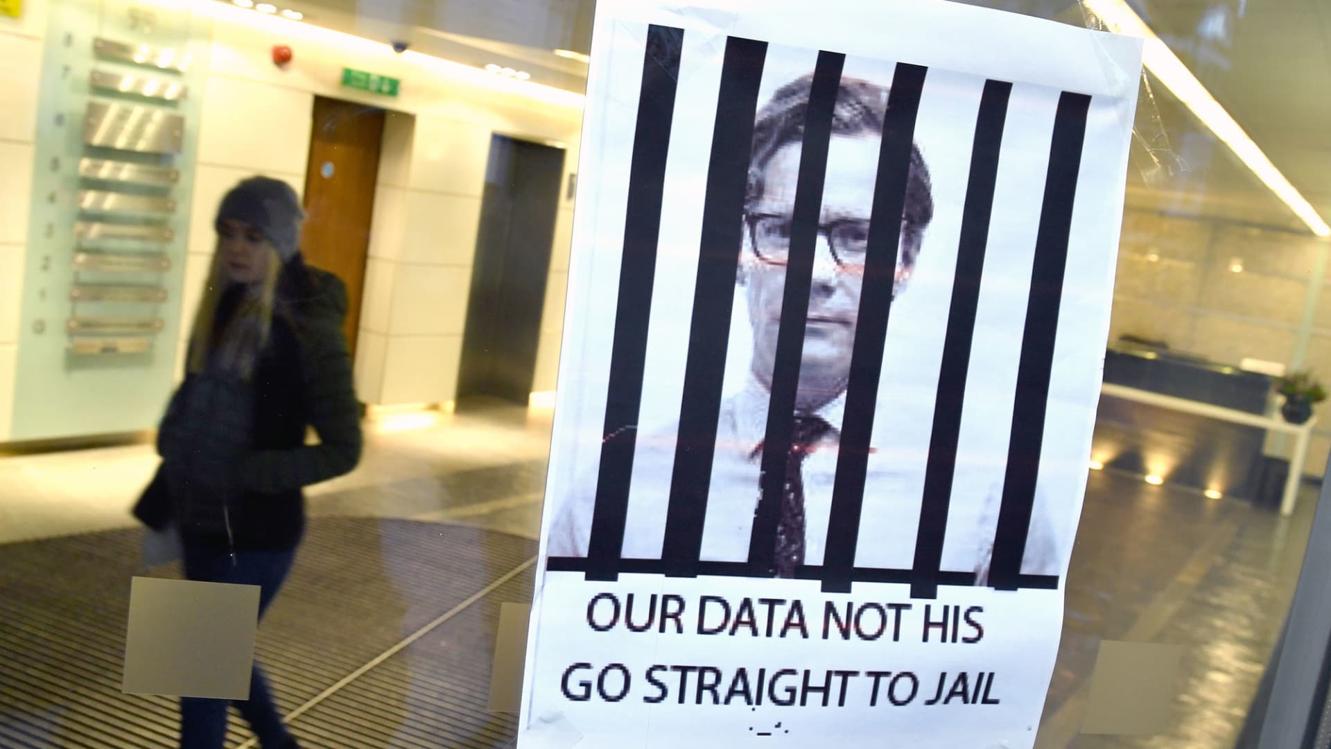 A sign put up by a protestor at the offices of Cambridge Analytica in central London, England.