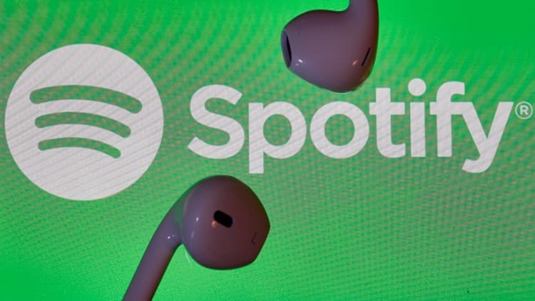 Spotify shines in market debut