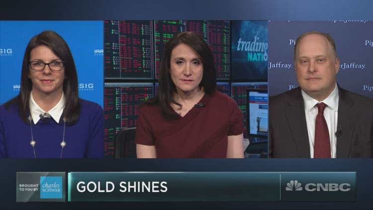 Gold may be having a major moment as volatility slams the market. Here's how to play it