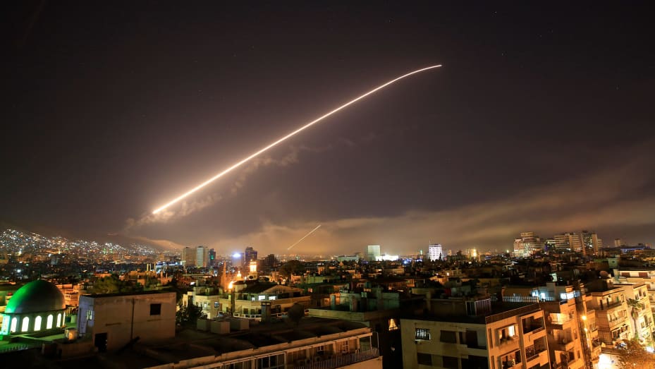 Damascus sky lights up with service to air missile fire as the U.S. launches an attack on Syria targeting different parts of the Syrian capital Damascus, Syria, early Saturday, April 14, 2018.