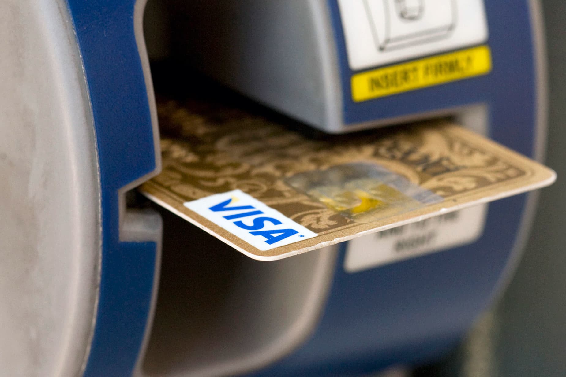 Visa drops after report says DOJ investigates debit card businesses