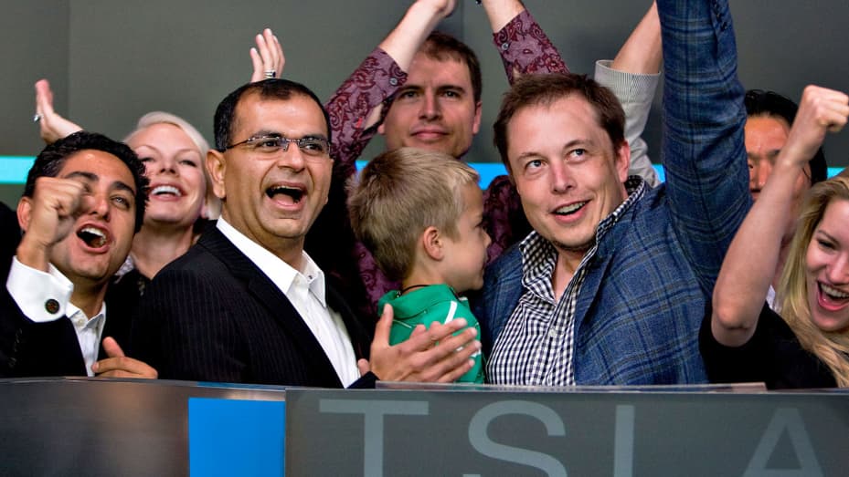 Deepak Ahuja, Tesla CFO (left) and Elon Musk, Tesla founder and CEO (right), at the Nasdaq opening bell ceremony for the Tesla initial public offering on Tuesday, June 29, 2010.