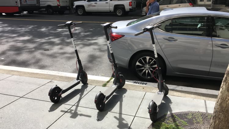 Electric scooters draw hordes of users and investors but also critics 