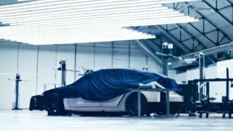 Tesla video teases unnamed vehicle under a sheet, and new Roadster accelerating