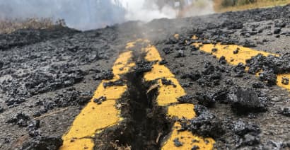 Quakes damage roads as ash spews from Hawaii volcano