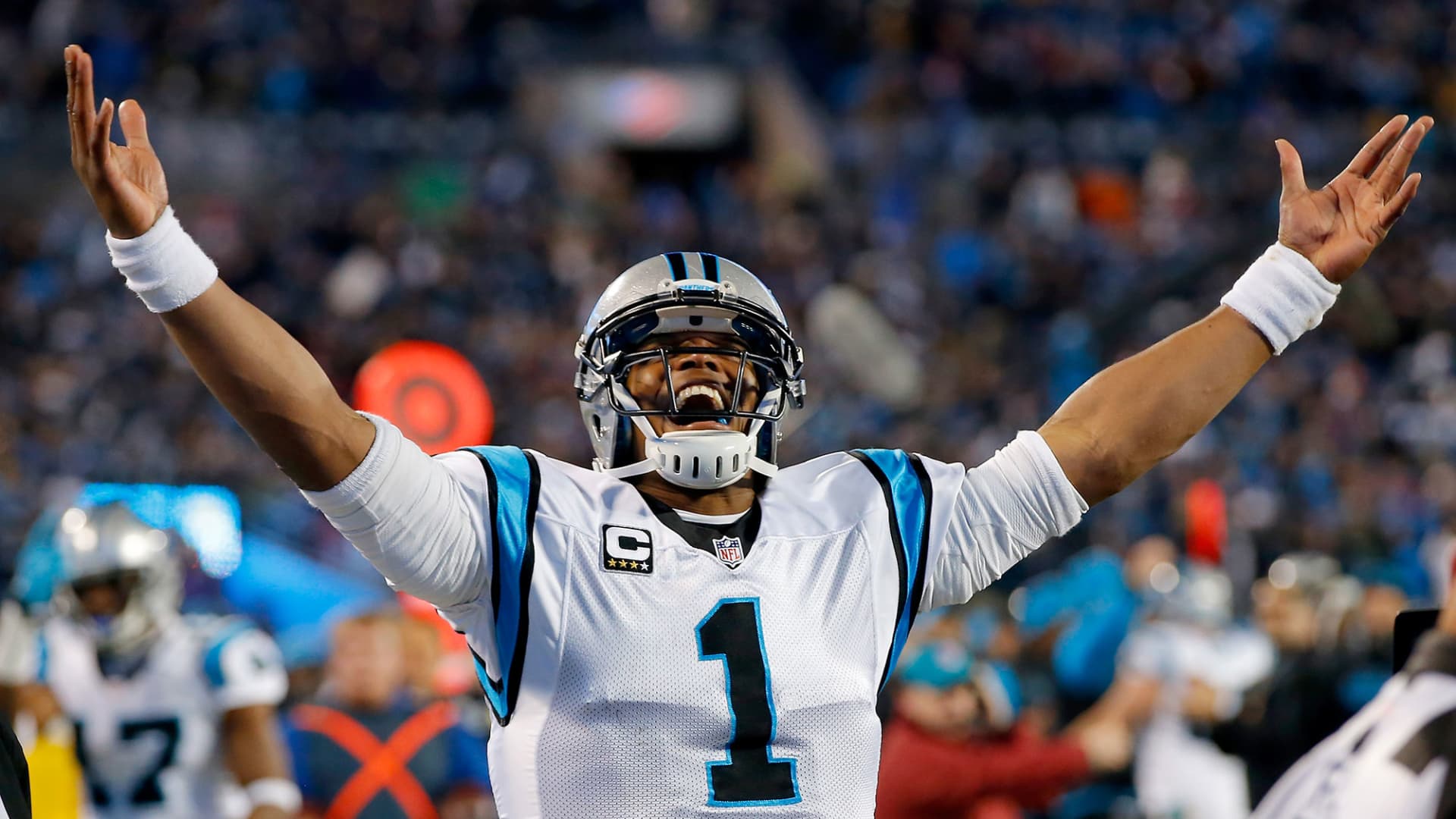 Cam Newton #1 of the Carolina Panthers celebrates Ted Ginn Jr. #19 touchdown in the first quarter against the Arizona Cardinals during the NFC Championship Game at Bank of America Stadium on January 24, 2016 in Charlotte, North Carolina.