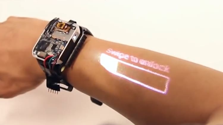 This watch uses a built-in projector to turn your arm into a touchscreen