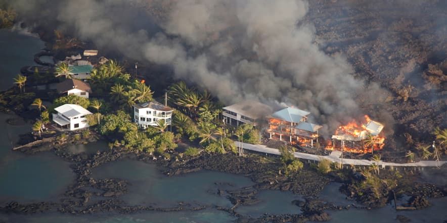 Explosion at Hawaii volcano spews ash as lava flows into sea