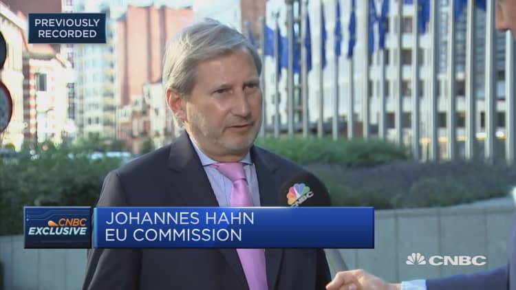 EU’s Hahn: Migration will remain a big issue for the next decade