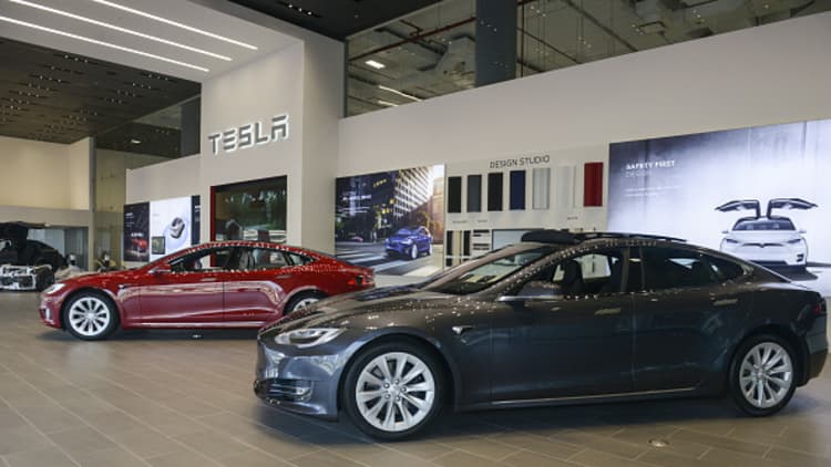 CFRA downgrades Tesla, says production rate not financially sustainable