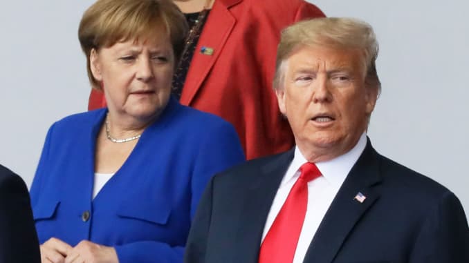 German Chancellor Angela Merkel and U.S. President Donald Trump are seen as they pose for a family photo at the start of the NATO summit in Brussels, Belgium July 11, 2018.