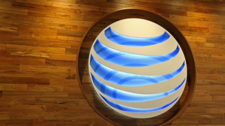 AT&T downgraded to 'market perform' as DOJ targets deal