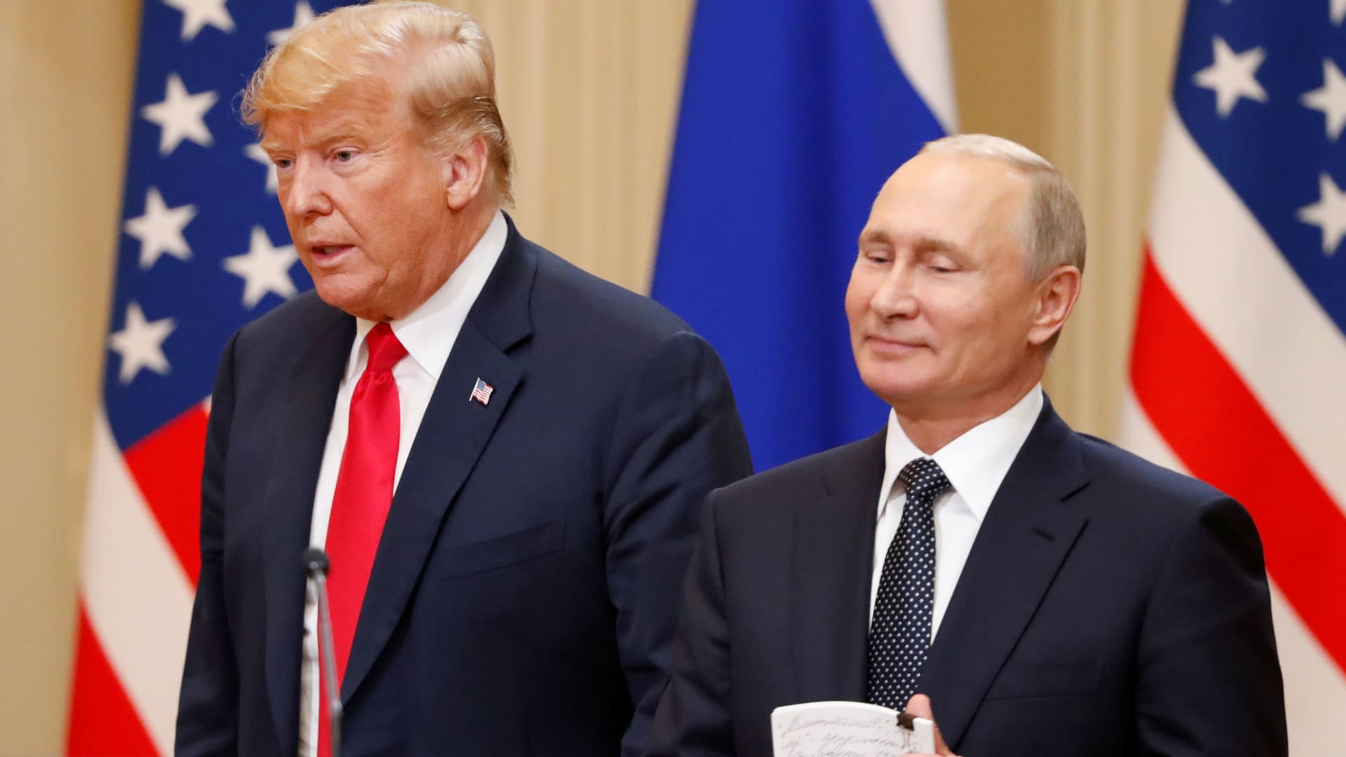 President Donald Trump and Russian President Vladimir Putin arrive for a joint news conference after their meeting in Helsinki, July 16, 2018. 