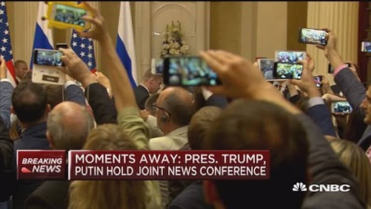 Reporter escorted out of Trump-Putin news conference