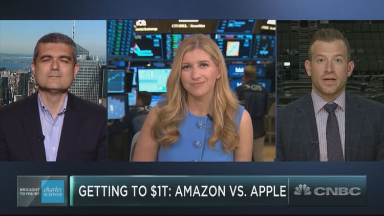 As Apple and Amazon race to the world’s first $1 trillion company, experts choose unlikely winner