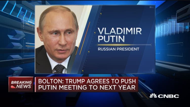 John Bolton: Trump agrees to push Putin meeting to next year