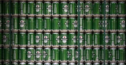 Heineken unveils 2 billion euro cost saving plan as earnings sink