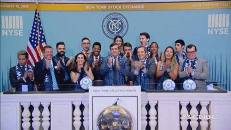 New York City Football Club rings the opening bell at the NYSE