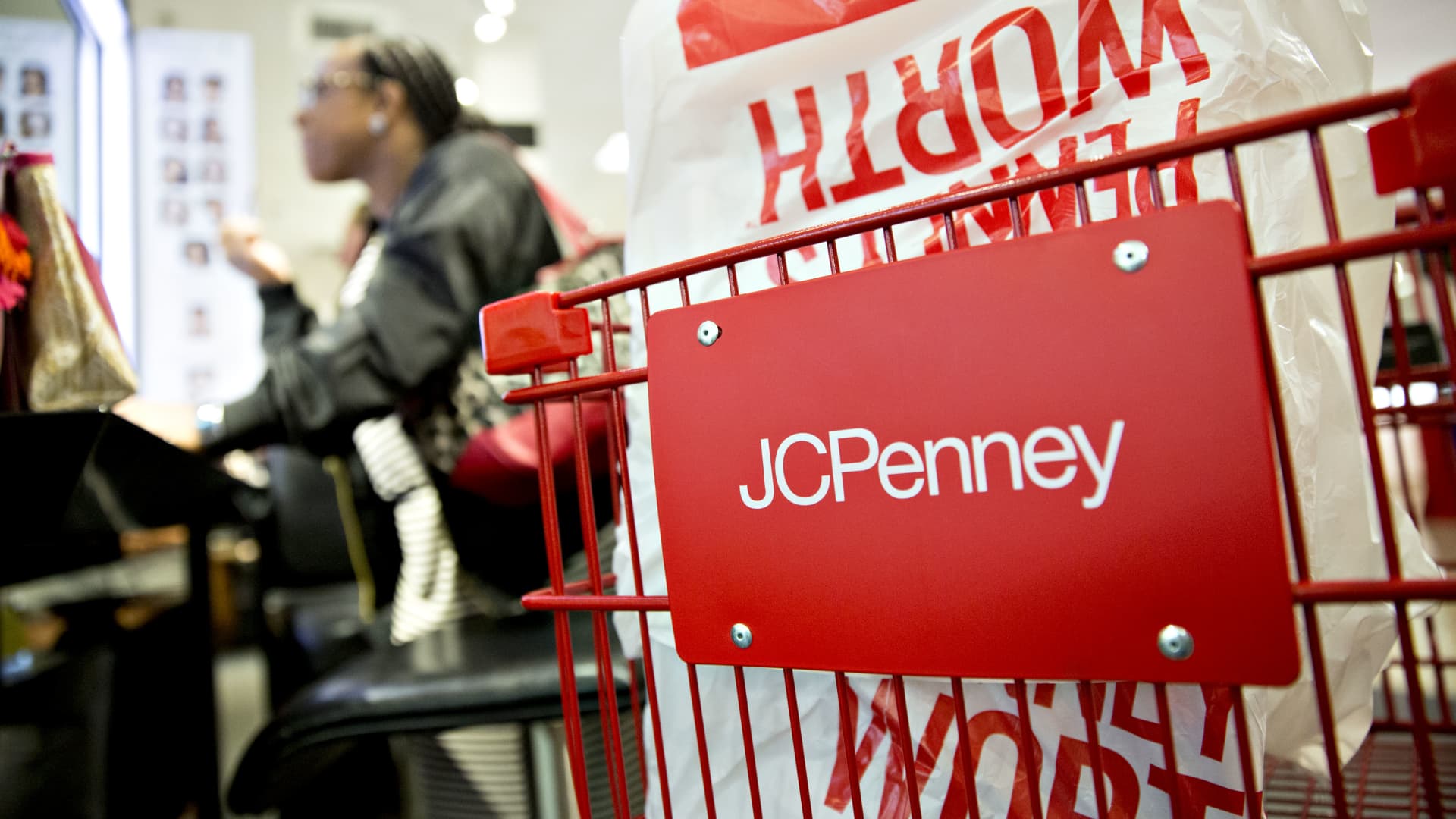 Signage is seen on a shopping cart inside a J.C. Penney Co. store in Peoria, Illinois.