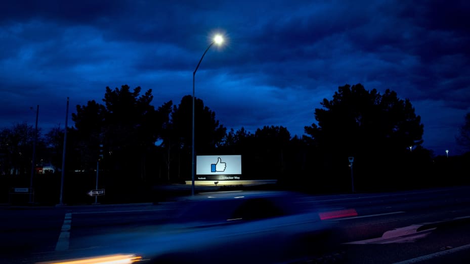 A car passes by Facebook's corporate headquarters location in Menlo Park, California, on March 21, 2018. 