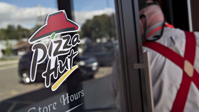 A customer enters a Pizza Hut restaurant in Princeton, Illinois.