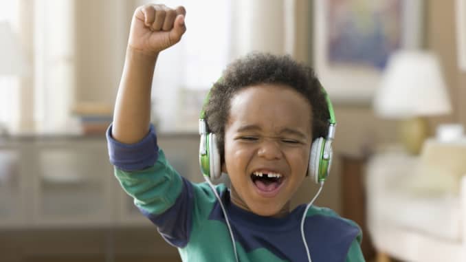 A child listening to music on headphones.