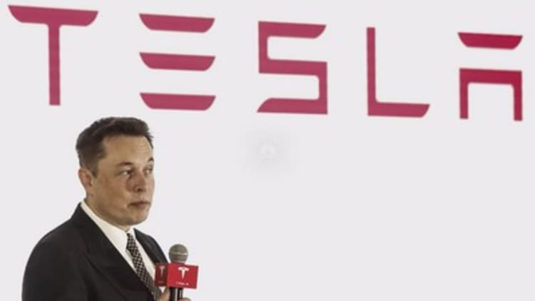 Three experts on the future of Tesla after Elon Musk settled with SEC