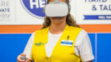 A Walmart employee takes a STRIVR course on Oculus Go.