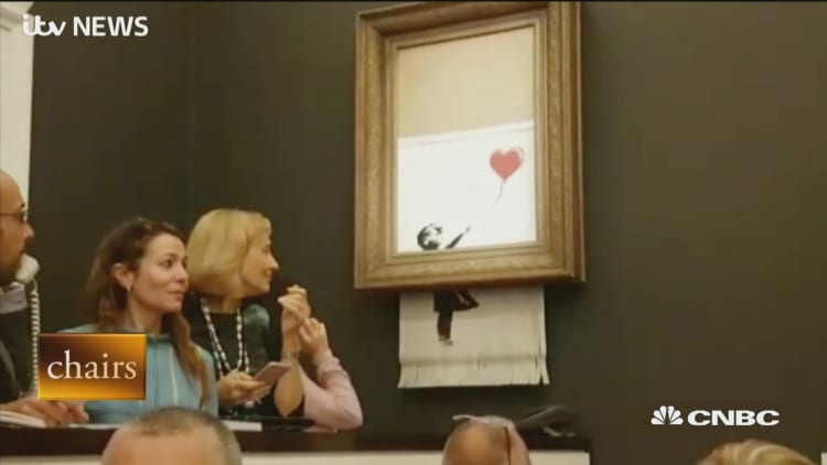 Banksy painting self shreds after being sold