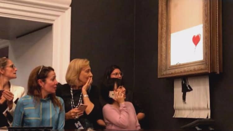 Banksy painting 'self-destructs' after Sotheby's sale