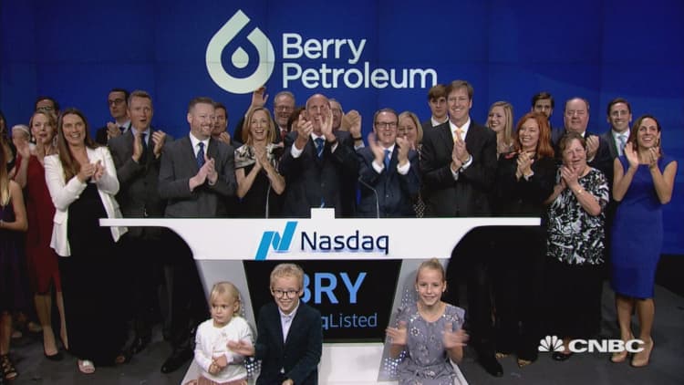 Executives at Berry Petroleum ring the closing bell at the Nasdaq