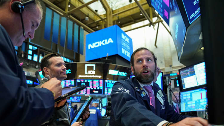 Dow finishes higher for first time in four sessions