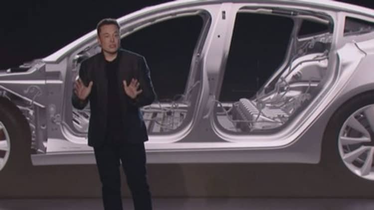 Tesla CEO Elon Musk just unveiled a cheaper Model 3