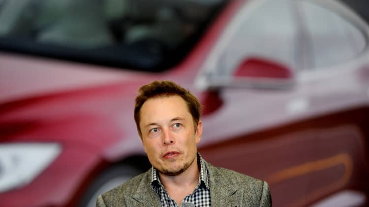 Watch three Tesla experts debate the electric car maker's mixed earnings report
