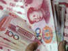 Chinese yuan notes at a branch of Industrial and Commercial Bank of China.