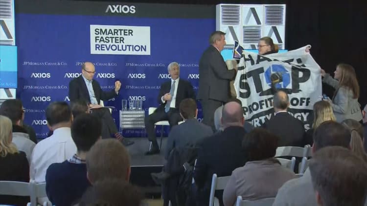 JP Morgan CEO Jamie Dimon confronted by protesters at Axios event