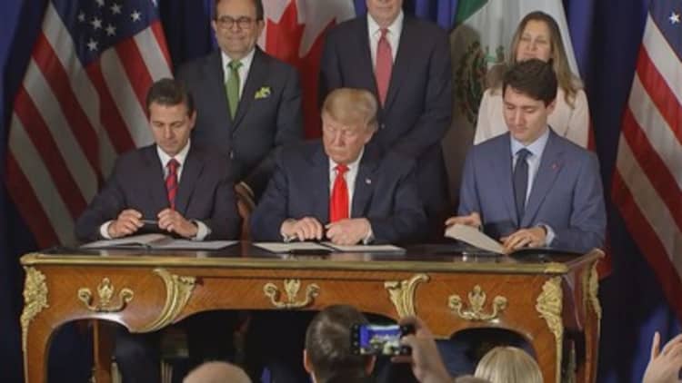 Trump and the leaders of Mexico and Canada sign trade pact at G-20 in Buenos Aires