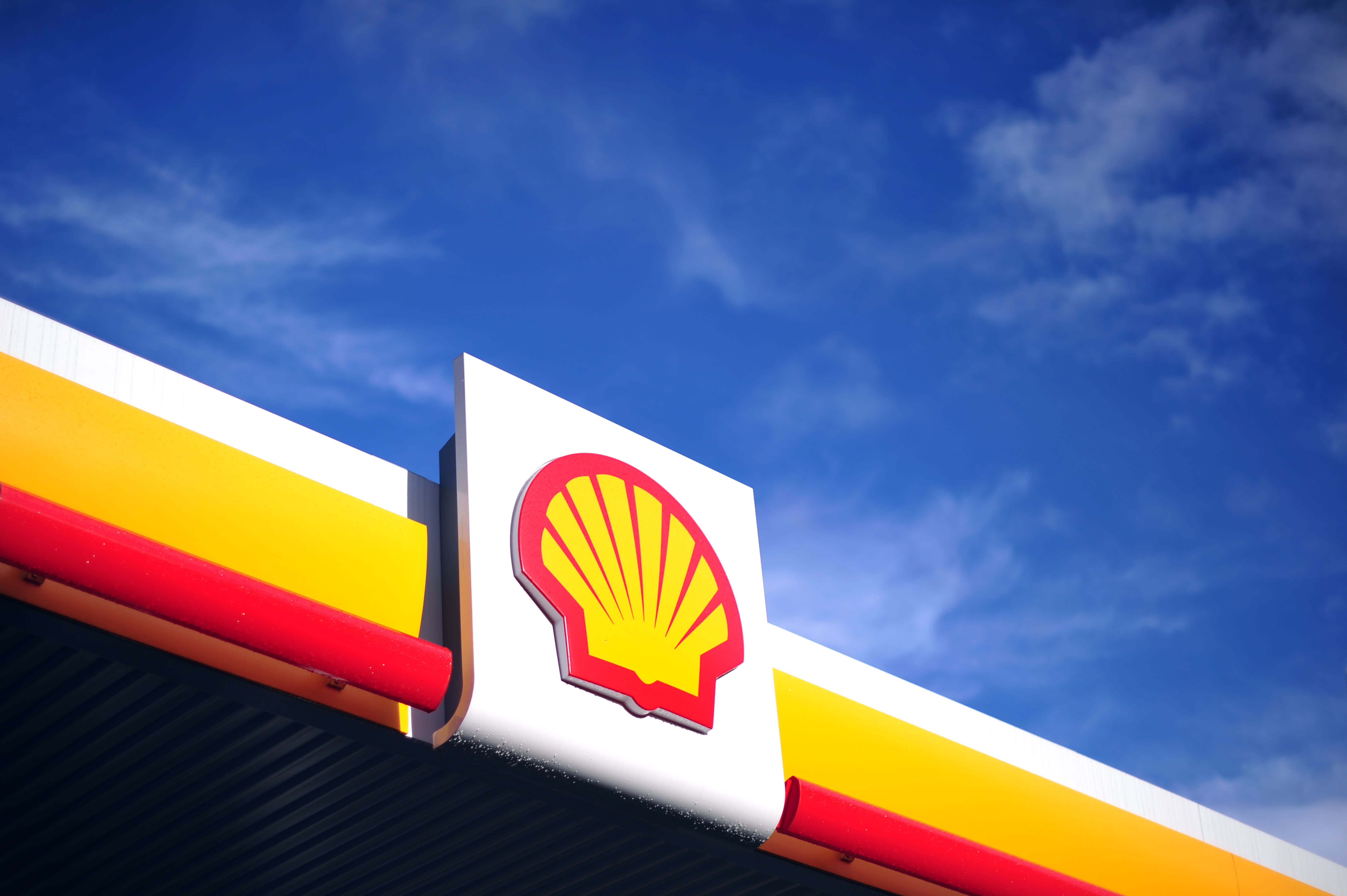 Shell reports sharp drop in profit for the year, increases dividend