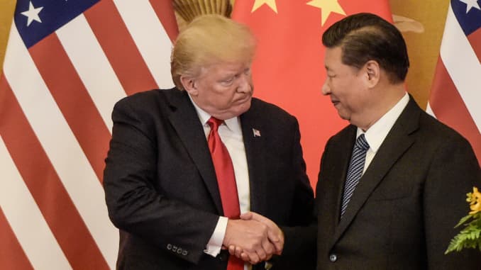 President Donald Trump (L) shakes hand with Chinese President Xi Jinping at the end of a press conference at the Great Hall of the People in Beijing on November 9, 2017.