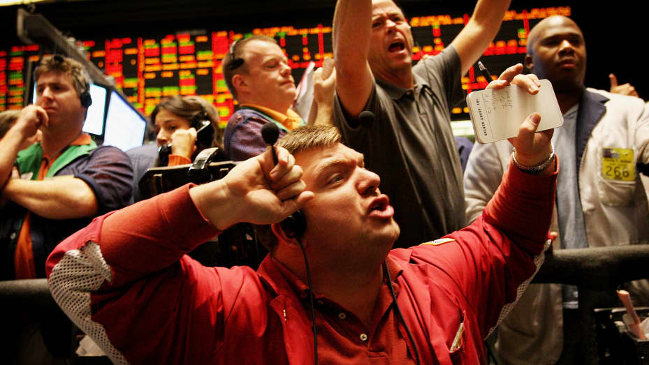 Traders signal offers in the Ten-Year Treasury Note Options pit at the Chicago Board of Trade.