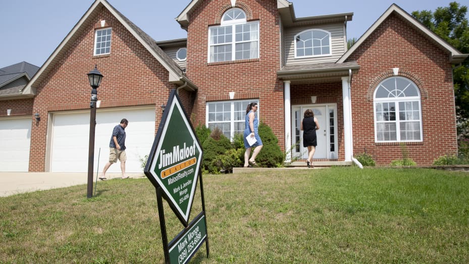 Prospective home buyers arrive with a realtor to a house for sale in Dunlap, Illinois.