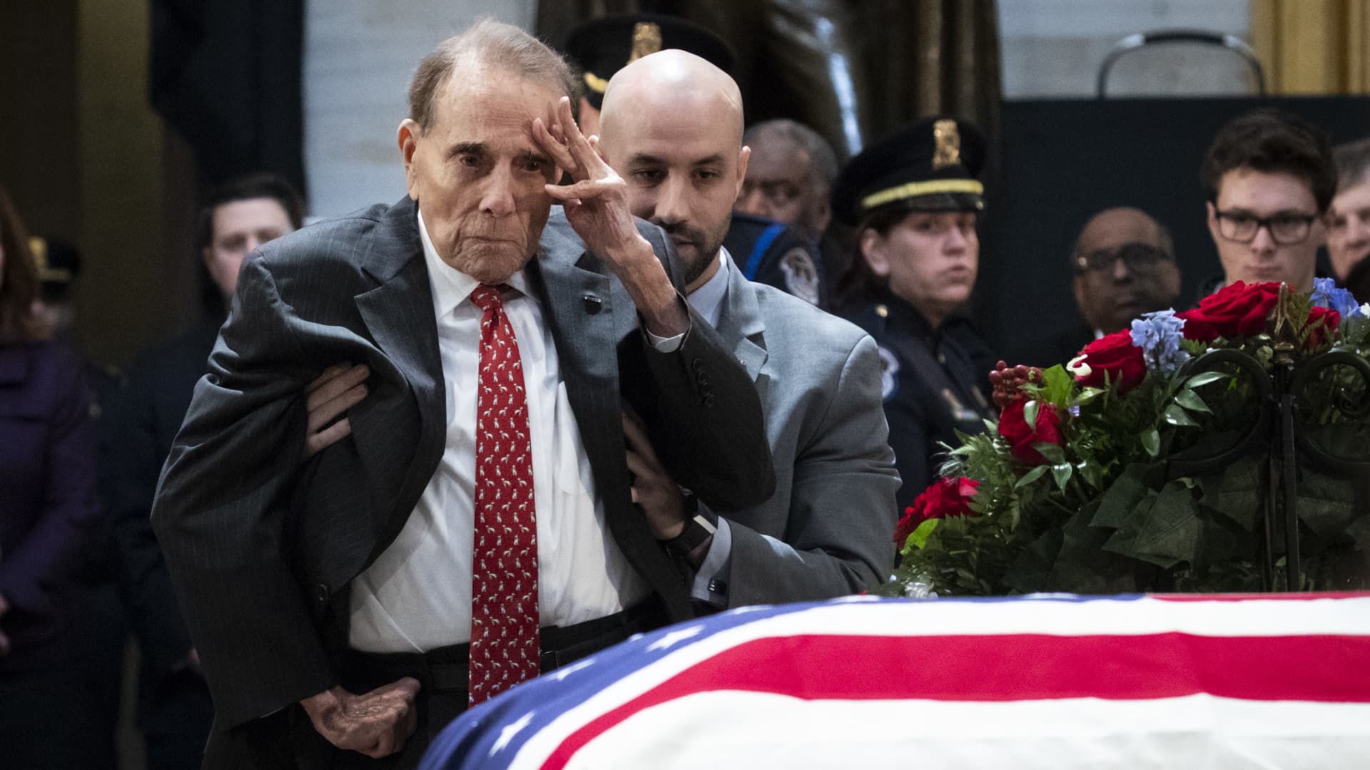 Former Sen. Bob Dole salutes the casket of former President George H.W. Bush, U.S. Capitol, December 4, 2018 in Washington, DC. 