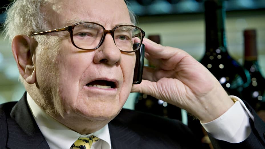 Billionaire investor Warren Buffett, chairman of Berkshire Hathaway, speaks on a mobile phone during an interview in New York, U.S., on Wednesday, June 25, 2008.