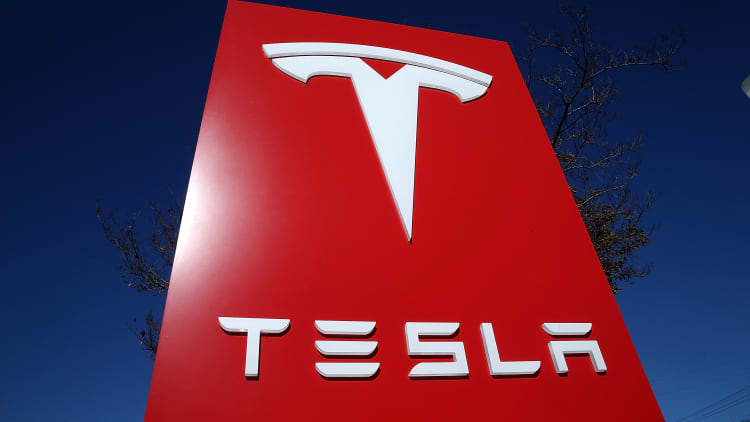 Tesla is laying off workers. Here's what investors need to know.