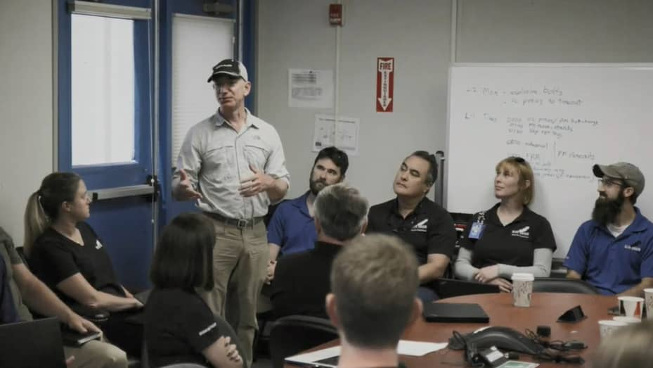 Blue Origin founder Jeff Bezos speaks to company employees during a launch preparation meeting in 2019.